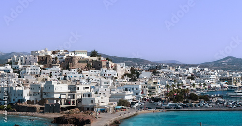 Naxos town view, blue sea, white greek buildings, sunny vacation day, tourism concept © Ela