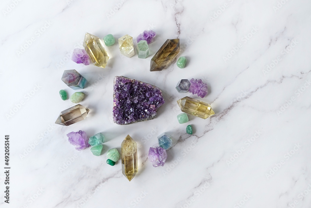 different crystal gemstones on marble background. Minerals set for healing esoteric ritual, spiritual Magic practice, relaxation and meditation. life balance concept. flat lay different crystal gemstones on marble background. Minerals set for healing esoteric ritual, spiritual Magic practice, relaxation and meditation. life balance concept. flat lay