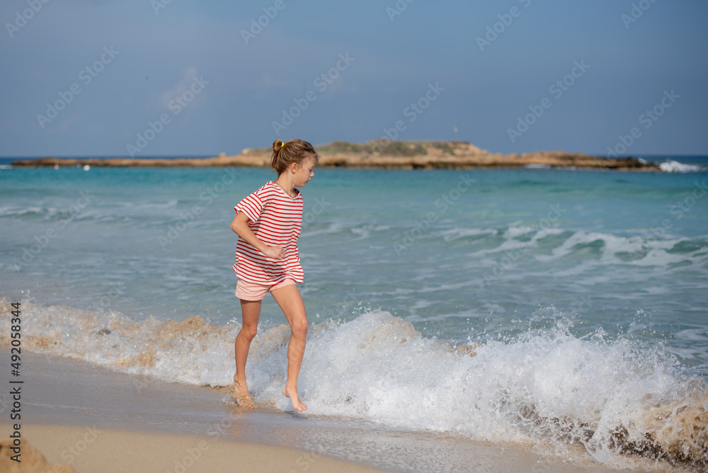 person running on the beach