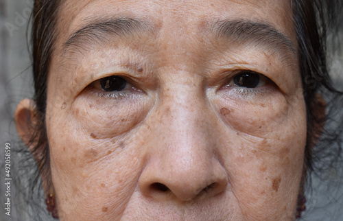 Face of Asian elder woman. Concept of aging. photo