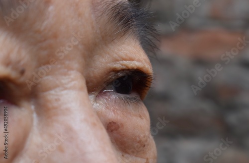 Eyes of Asian elder woman. Concept of aging. photo