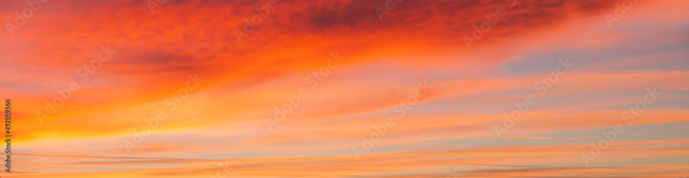 Panoramic view of sky with reddish clouds at sunset Panoramic view of sky with reddish clouds at sunset