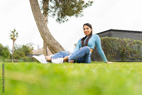 Cheerful Indian woman on lawn photo