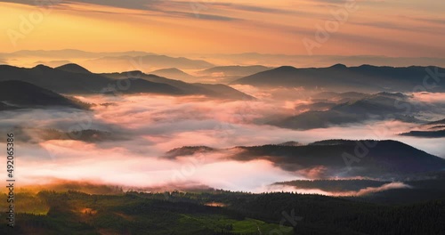 Fog over a mountain valley in the Carpathians at sunrise sweeps with great magical speed. Timelapse - accelerated filming of natural processes.