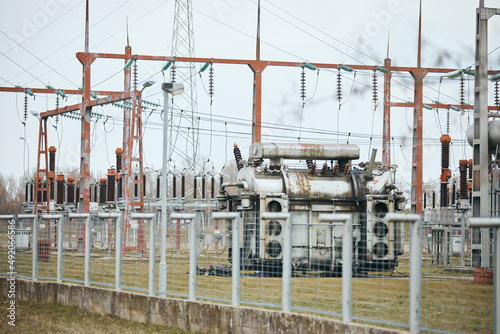 Rusty electricity substation and high voltage transformers.