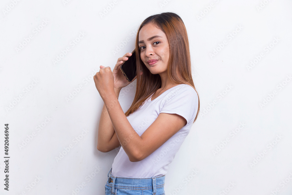 happy young asian beautiful woman using mobile phone isolated on white background
happy young asian beautiful woman using mobile phone isolated on white background