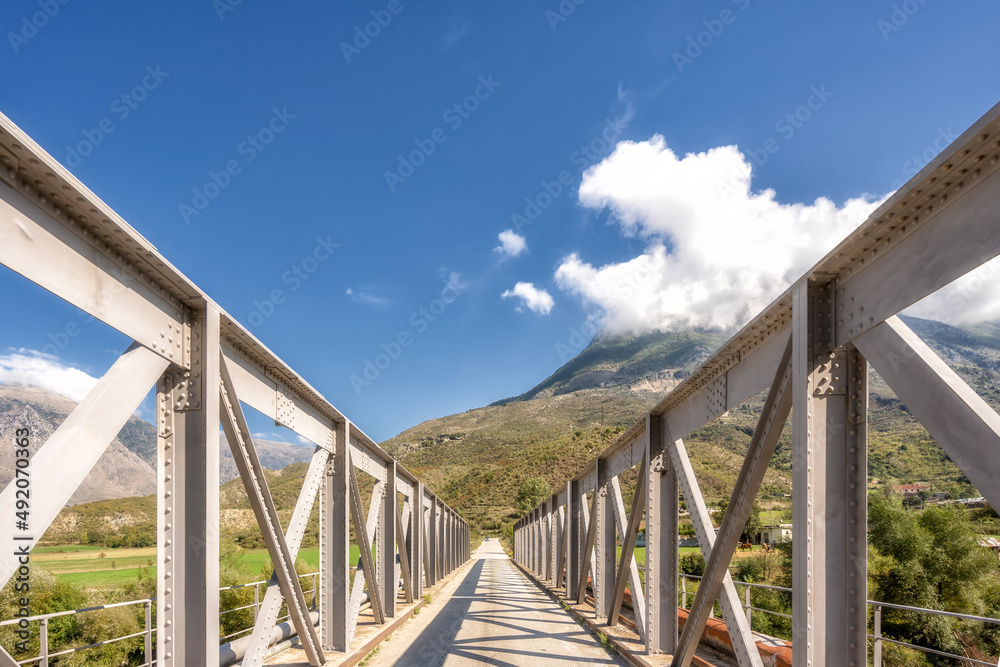 Bridge and blue cloudy sky.