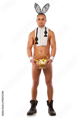 Canvas Print Lovely man in rabbit costume with easter eggs