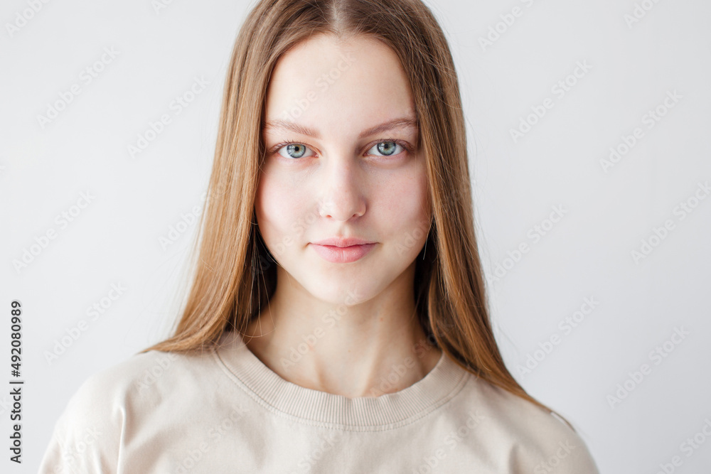 Portrait of young beautiful cute cheerful girl smiling over white background Portrait of young beautiful cute cheerful girl smiling over white background