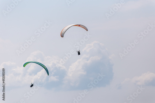 Paraplaners with beautiful blue sky and clounds in the background