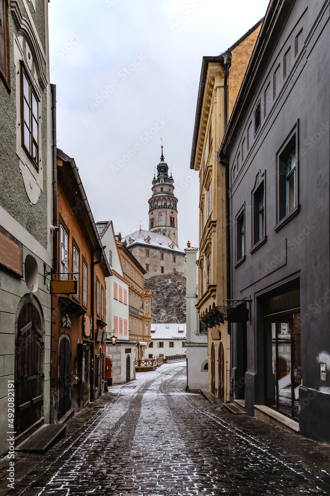 Cesky Krumlov,Czech Republic.Empty snowy street of famous Czech medieval town.Historic centre with Gothic,Renaissance,Baroque architecture and castle.UNESCO heritage site.Urban monument reservation.