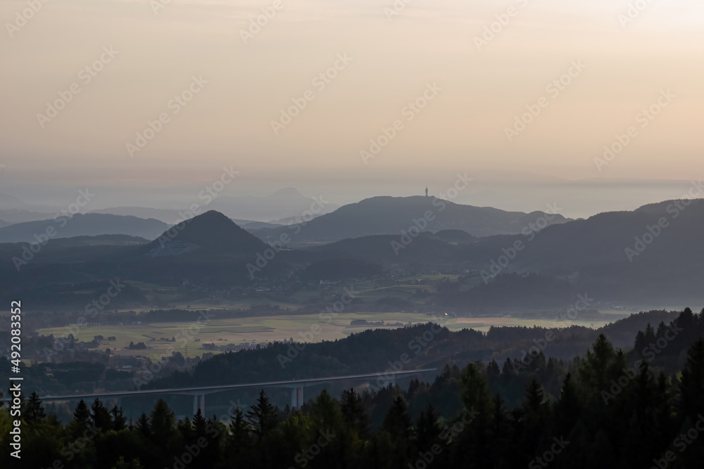 Scenic morning view from Ferlacher Spitze on Pyramidenkogel and Kathreinkogel in the Karawanks in Carinthia, Austria. Borders between Austria, Slovenia, Italy. Karawanks motorway, highway A2. Rosental