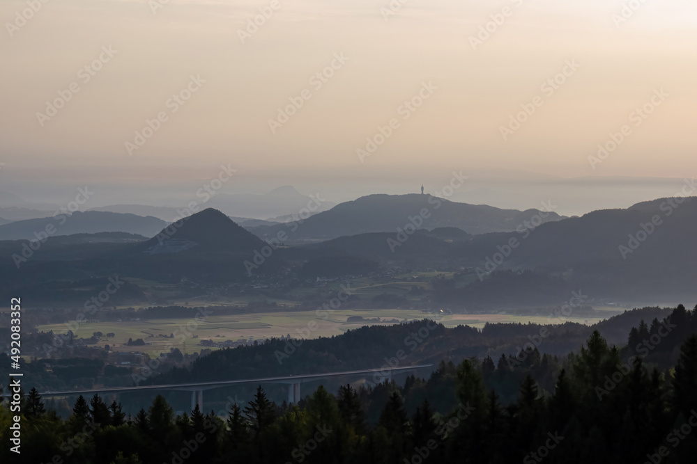 Scenic morning view from Ferlacher Spitze on Pyramidenkogel and Kathreinkogel in the Karawanks in Carinthia, Austria. Borders between Austria, Slovenia, Italy. Karawanks motorway, highway A2. Rosental Scenic morning view from Ferlacher Spitze on Pyramidenkogel and Kathreinkogel in the Karawanks in Carinthia, Austria. Borders between Austria, Slovenia, Italy. Karawanks motorway, highway A2. Rosental