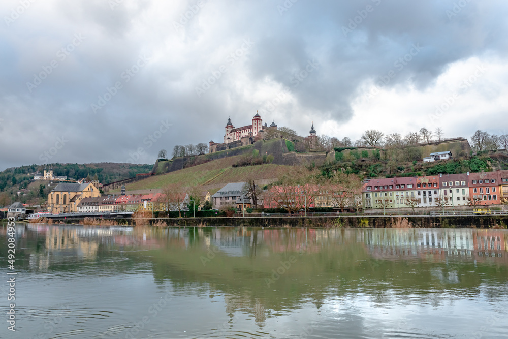 View of the western bank of the river Main that crosses Wurzburg, in Bavaria, Germany, with the Marienberg Fortress dominating the background.
