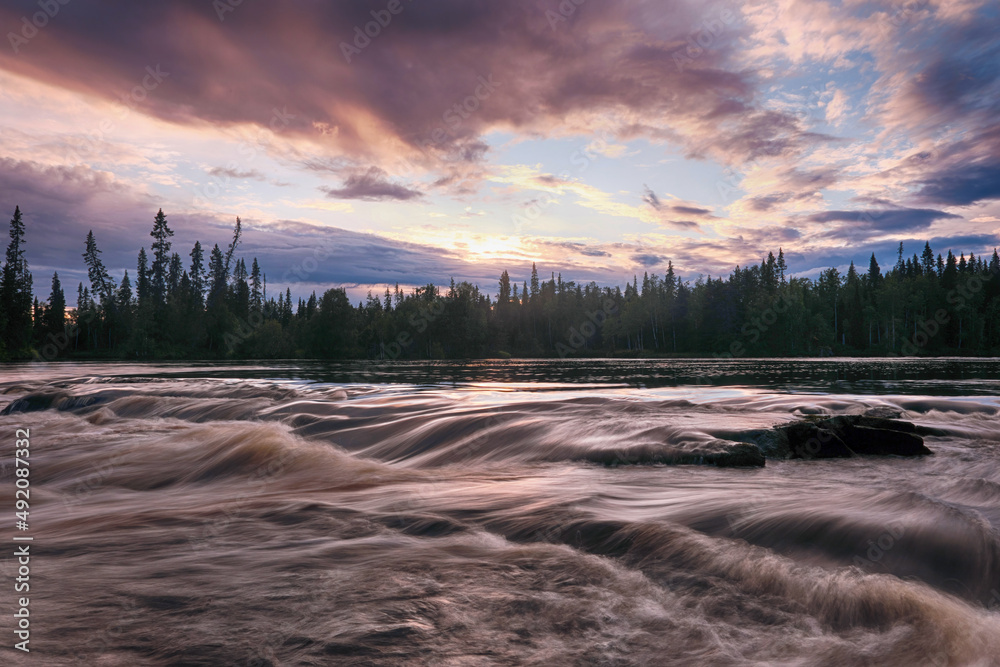 Sunset long exposure shot of Tuntsayoky river. Murmansk Oblast, Russia.