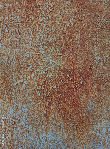 paint flakes on rusty metal sheet