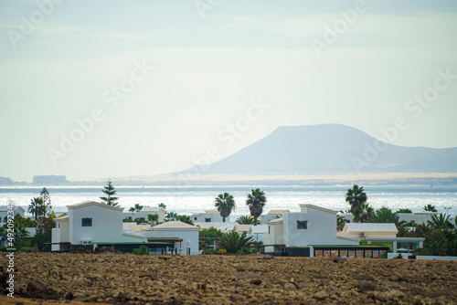 Buildings and houses typical of the island of Lanzarote in the Canary Islands, overlooking the volcanic rock formations