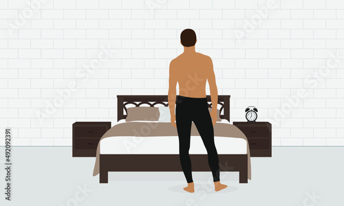 Male character in underpants stands near the bed in the room