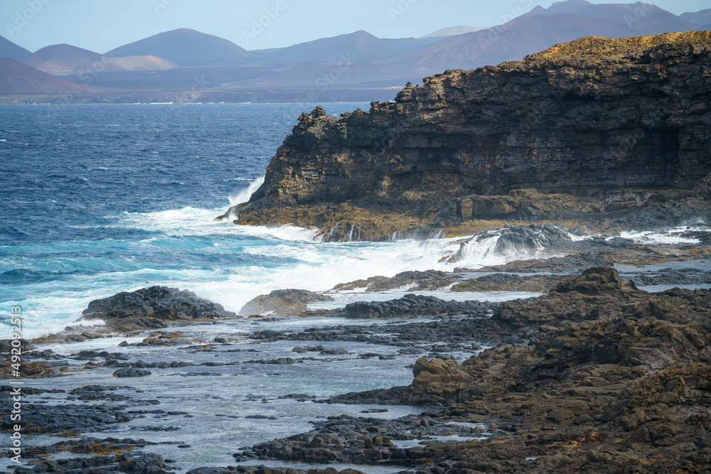 Waves breaking on the rocks in natural areas of the island of Lanzarote in the Canary Islands