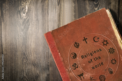 Science of world religions book on wooden table photo