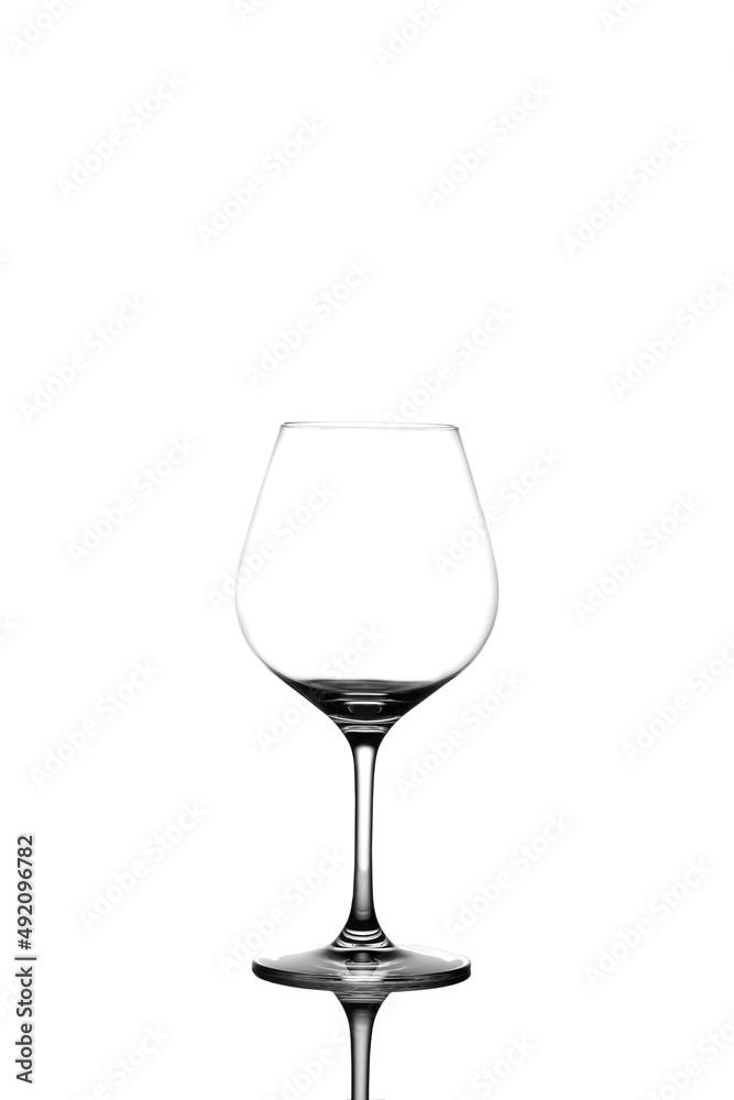 an empty wine glass stands on a white background