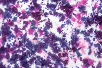 tie dye pattern hand dyed on cotton fabric background.