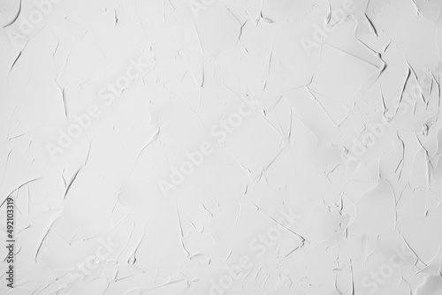 Fotografija Irregular white plaster texture applied with a spatula on a wal