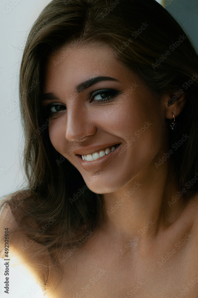 Woman smiling in blouse on white background. Woman smiling in blouse on white background.