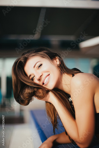Woman smiling in pool.