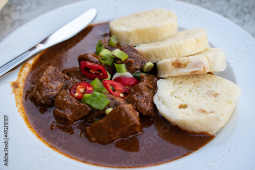 Traditional Czech Beef Goulash meal on a plate with bread
