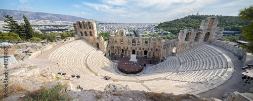 The ancient Odeon of Herodes Atticus colosseum on the Acropolis in Athens, Greece photo