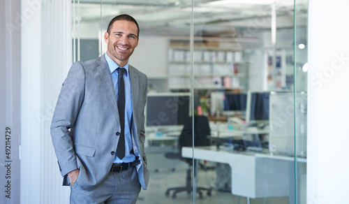 Wallpaper Mural Hes a corporate heavyweight. Shot of a handsome businessman standing in his office. Torontodigital.ca
