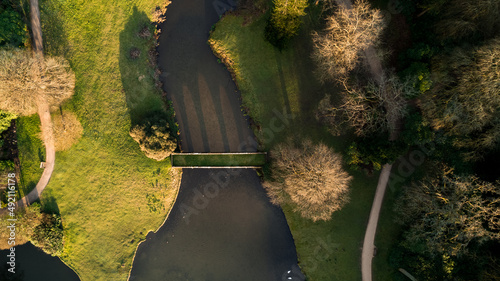 Grass topped bridge in stately garden
