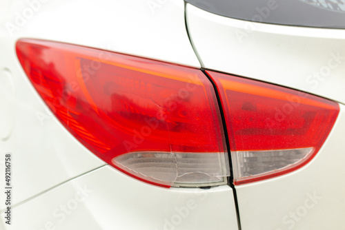 Damage to the taillight of the car, accident. Car insurance, background, close-up