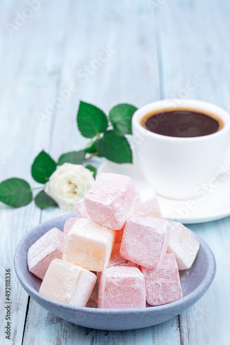 Turkish delight or lokum confection rose and lemon flavored with coffee and rose, copy space