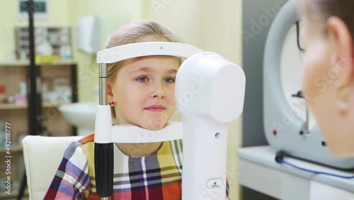 ophthalmological examination of the girl on the corneo topographer.modern clinic photo