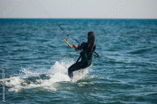 Woman kitesurfing on the ocean waters