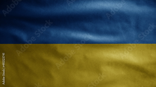 Ukrainian flag waving on wind. Close up of Ukraine banner blowing soft silk.