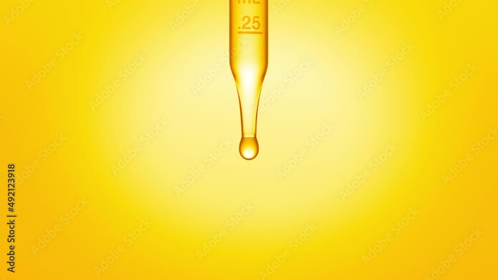 Close up macro shot of transparent fluid is dripped from graduated lab dropper on yellow background | Abstract skincare serum ingredients formulating concept