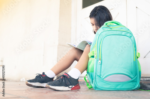 Alumnas en primer dia de clases con sus mochilas en la escuela, horizontal y vertical photo