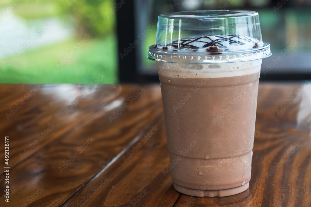Iced chocolate mocha blended with cream and in takeaway cup Iced chocolate mocha blended with cream and in takeaway cup