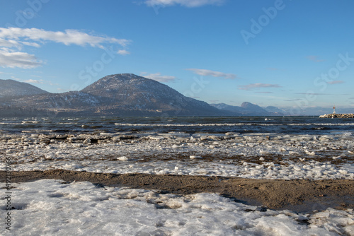 ice on the beach and mountains in the Okanagan Valley