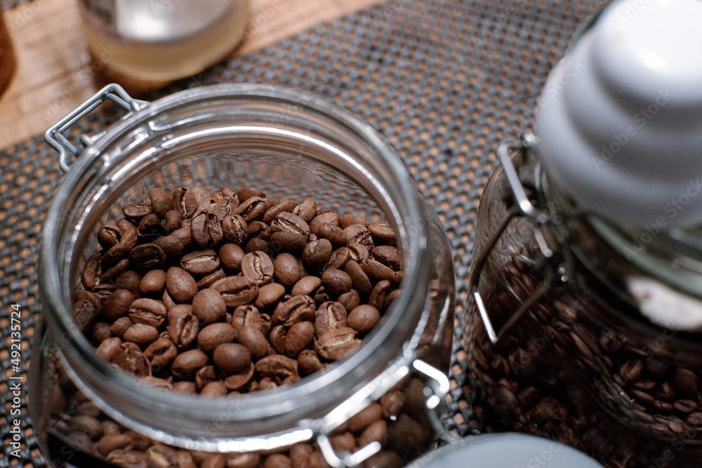 Fototapeta premium coffee in glass jar at barista table. top view