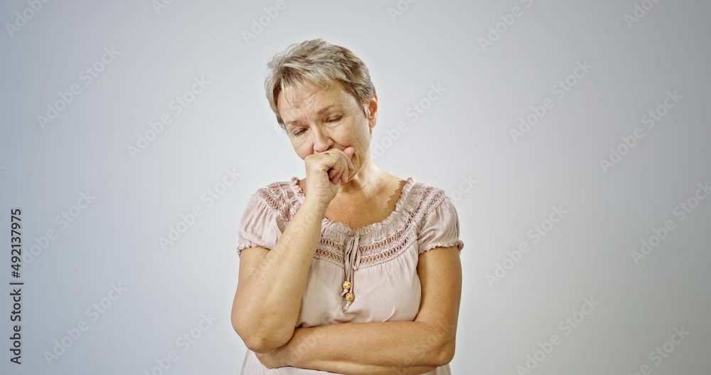 serious senior woman feeling worried about problems, pensive upset sad middle aged grey haired lady looking away thinking of loneliness, getting older and depression.