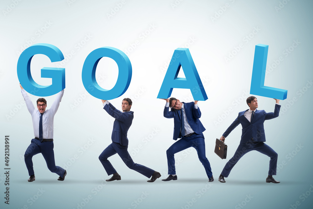 Businessman in goal concept carrying letters Businessman in goal concept carrying letters