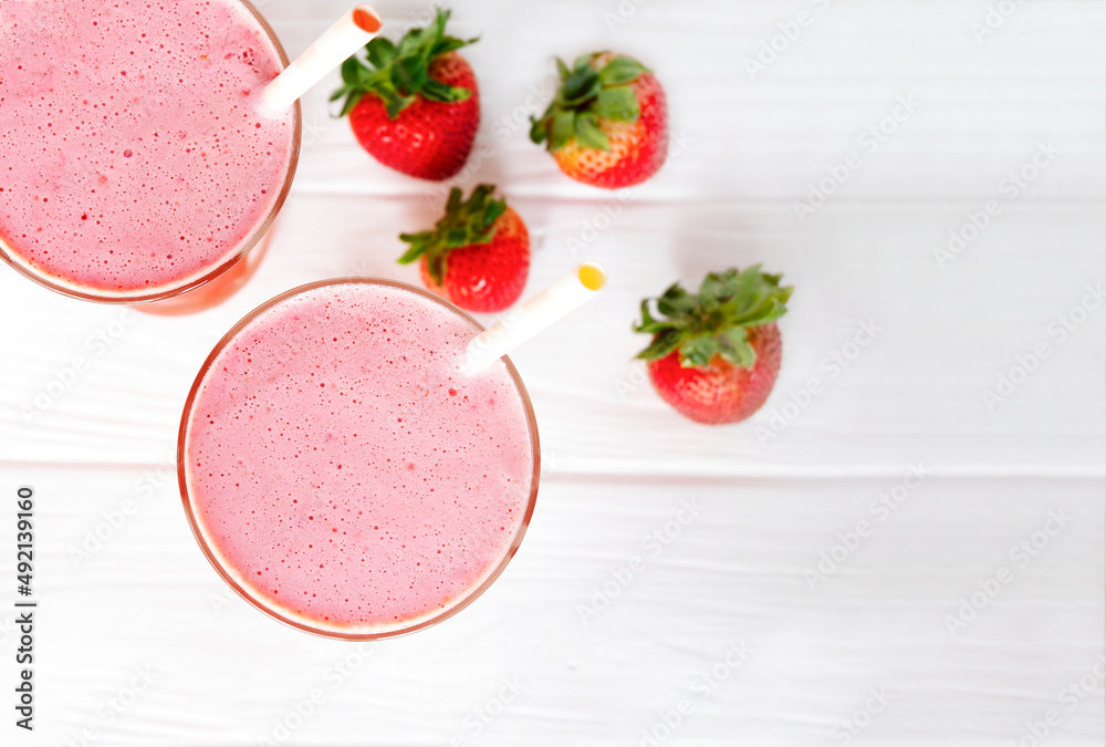 Strawberry yogurt fruit juice smoothie pink colorful fruit juice milkshake blend beverage healthy high protein the taste yummy In glass drink episode morning on white wood background. Strawberry yogurt fruit juice smoothie pink colorful fruit juice milkshake blend beverage healthy high protein the taste yummy In glass drink episode morning on white wood background.