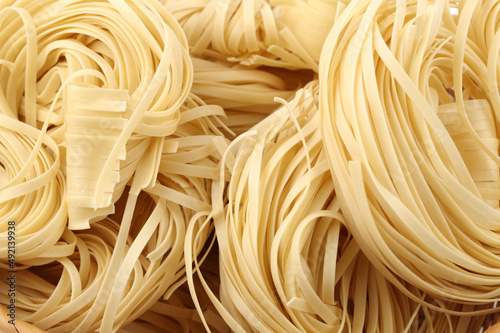 Italian pasta tagliatelle nest isolated on white