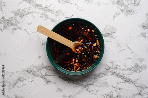 Chili oil sauce with sesame and peanuts called macha. Mexican food photo