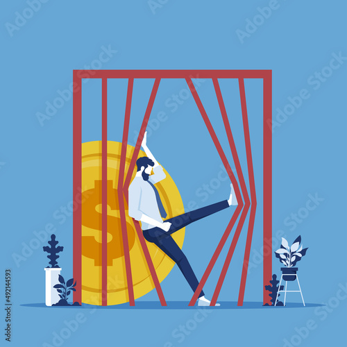 Businessman try bring dollar coins out from prison metaphor of financial freedom, freedom of money concept