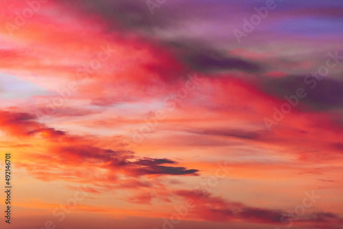 Beautiful stormy sunset sky.Beautiful clouds with sunset light in a blue sky Beautiful and gorgeous red sunset with clouds